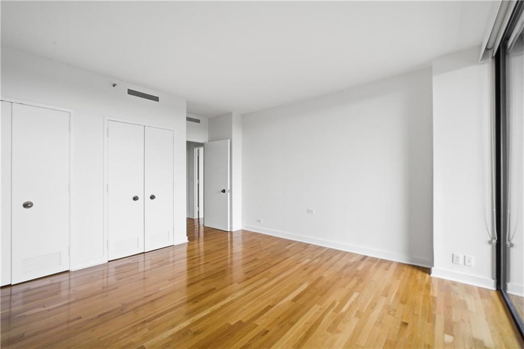 2660 Peachtree Road Northwest, Unit 9G Atlanta, GA 30305 - Photo 18 of 42 a view of an empty room and wooden floor