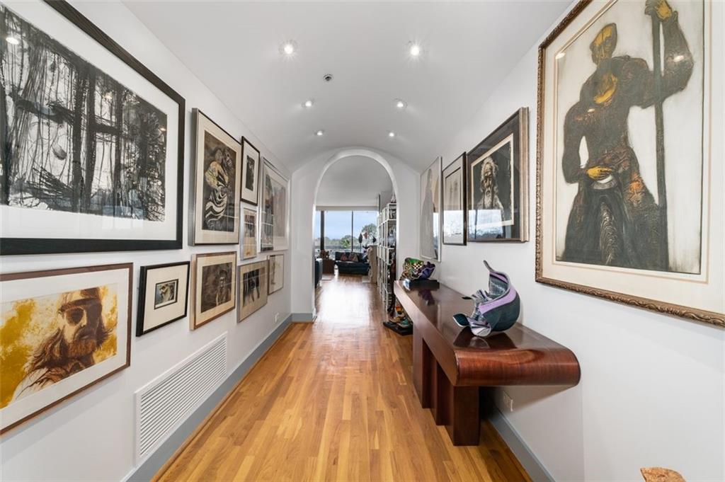 2660 Peachtree Road Northwest, Unit 9G Atlanta, GA 30305 - Photo 2 of 37 a living room with furniture and a fireplace