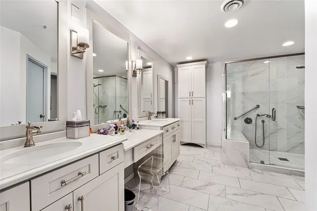 a spacious bathroom with a double vanity sink mirror and double