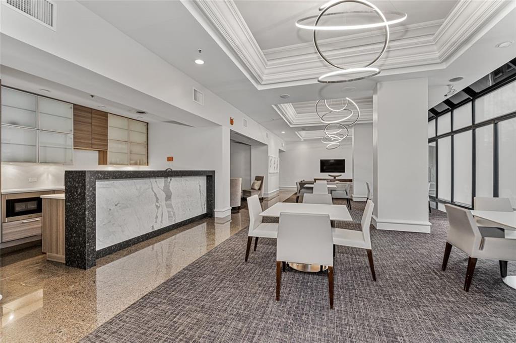 2660 Peachtree Road Northwest, Unit 9G Atlanta, GA 30305 - Photo 31 of 37 a view of a dining room with furniture