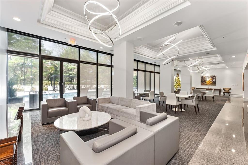 2660 Peachtree Road Northwest, Unit 9G Atlanta, GA 30305 - Photo 33 of 42 a living room with furniture and a large window