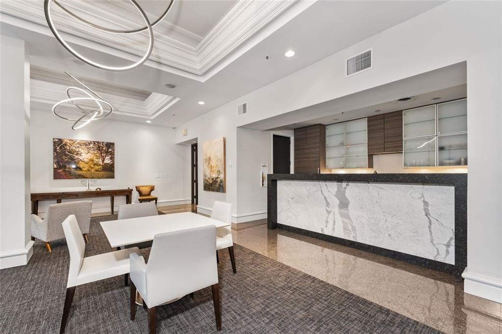 2660 Peachtree Road Northwest, Unit 9G Atlanta, GA 30305 - Photo 33 of 37 a living room with furniture and a window