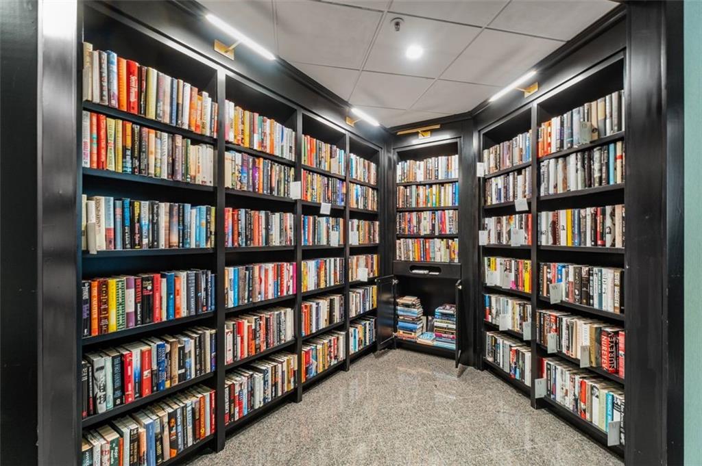 2660 Peachtree Road Northwest, Unit 9G Atlanta, GA 30305 - Photo 34 of 42 a view of room with windows book shelves