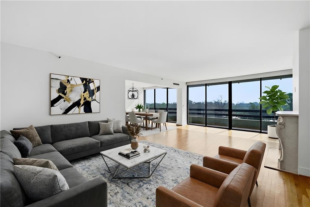 2660 Peachtree Road Northwest, Unit 9G Atlanta, GA 30305 - Photo 4 of 42 a living room with furniture and a large window