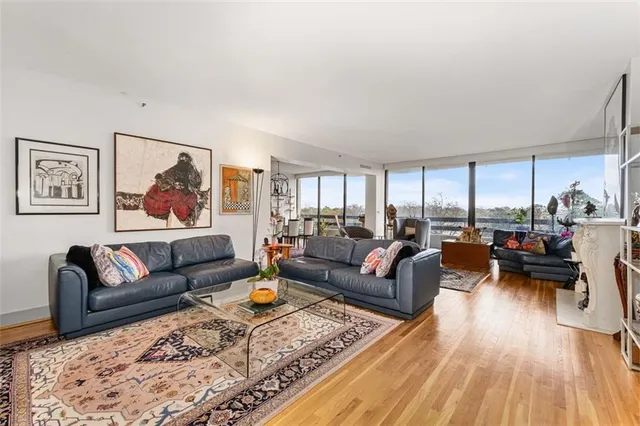 a living room with furniture or couch and a wooden floor
