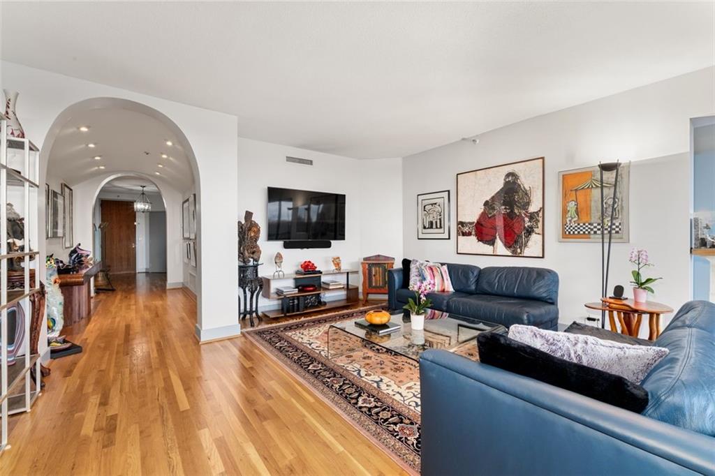 2660 Peachtree Road Northwest, Unit 9G Atlanta, GA 30305 - Photo 5 of 37 a living room with furniture and a flat screen tv