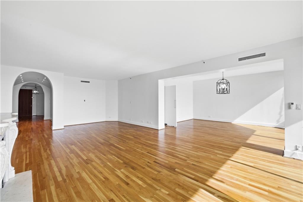 2660 Peachtree Road Northwest, Unit 9G Atlanta, GA 30305 - Photo 5 of 42 a view of empty room with wooden floor