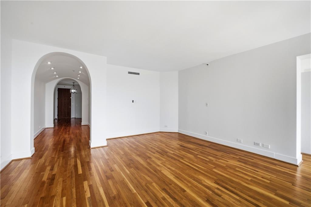 2660 Peachtree Road Northwest, Unit 9G Atlanta, GA 30305 - Photo 7 of 42 a view of empty room with wooden floor