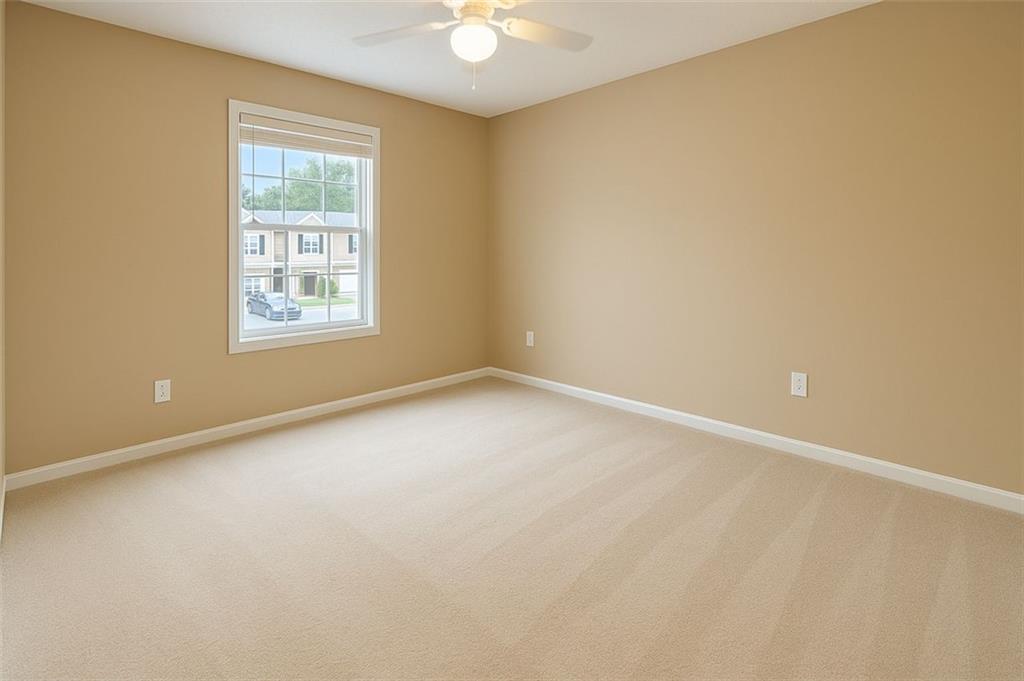 708 Summer Place Northwest Norcross, GA 30071 - Photo 5 of 6 an empty room with a window