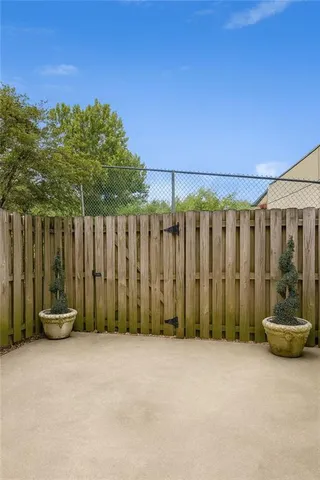 a view of a chair and tables in the patio