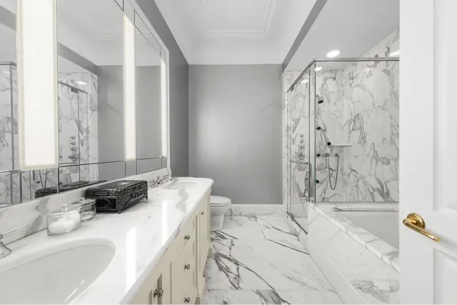 a bathroom with a granite countertop tub sink and a shower