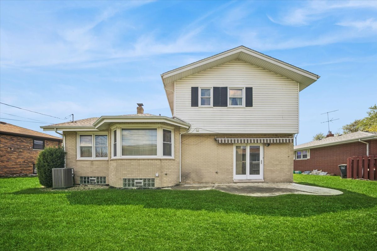 2316 185th Place Lansing, IL 60438 - Photo 2 of 21 a front view of a house with a yard