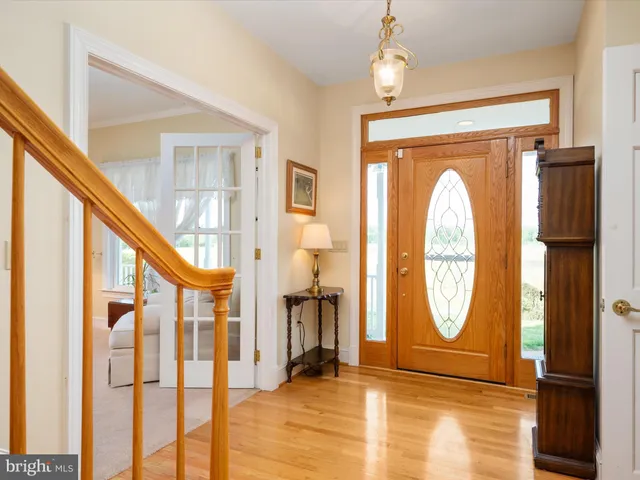 a view of a livingroom with furniture window and wooden floor