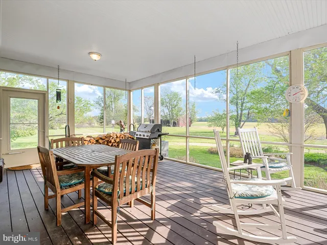 a bathroom with a granite countertop bathtub a sink and a shower