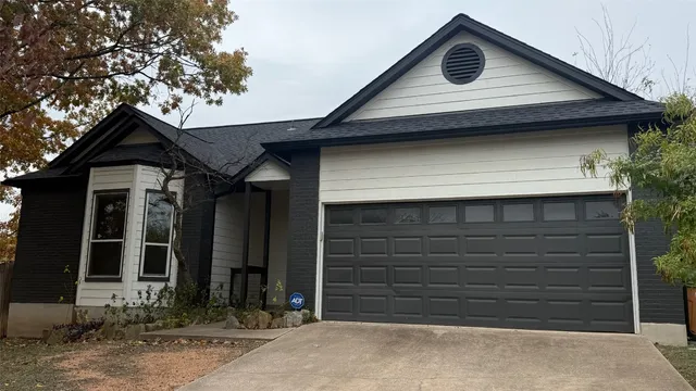 a front view of a house with a garage