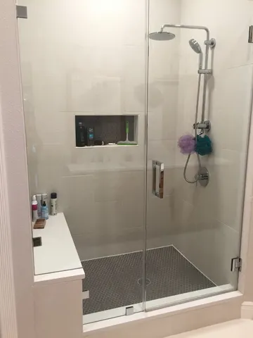 a bathroom with a shower and a sink