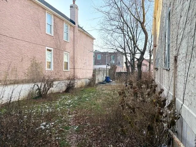 a view of a yard covered with snow