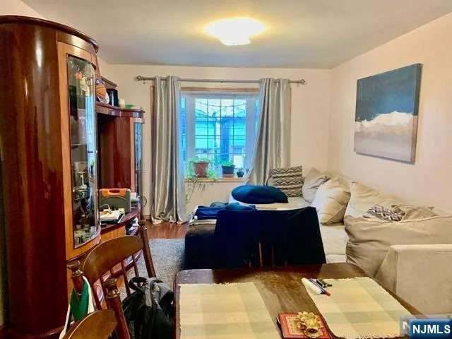 a living room with furniture and large windows