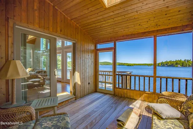 a bedroom with bed and a window