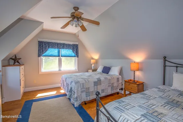 a bed room with a bed and a window