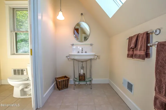 a bedroom with bed and a window