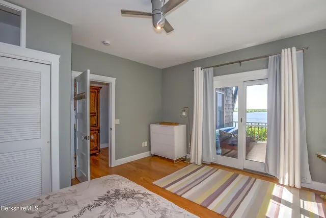 a balcony with furniture and wooden floor