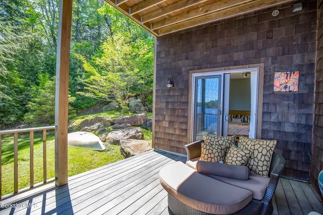 a view of a patio with a table and chairs