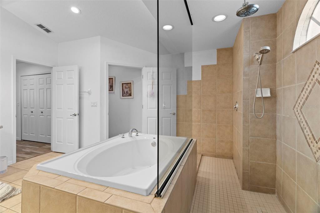 4061 Misty View Drive Spring Hill, FL 34609 - Photo 38 of 70 a bathroom with a tub and shower