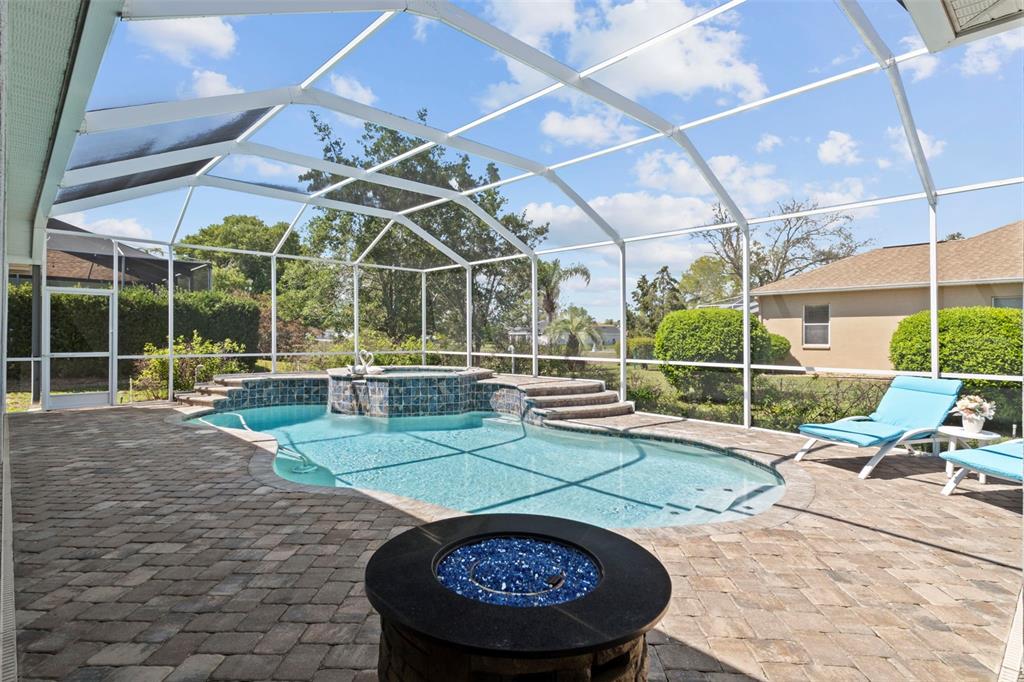 4061 Misty View Drive Spring Hill, FL 34609 - Photo 54 of 70 a view of a swimming pool with a patio