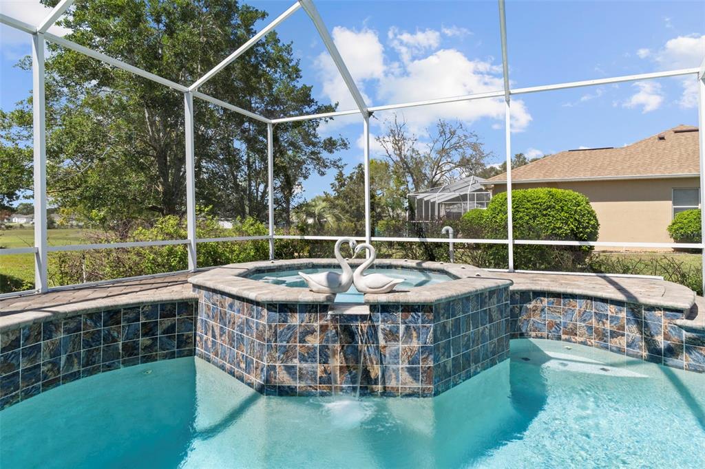 4061 Misty View Drive Spring Hill, FL 34609 - Photo 59 of 70 a view of a chairs and table in the patio
