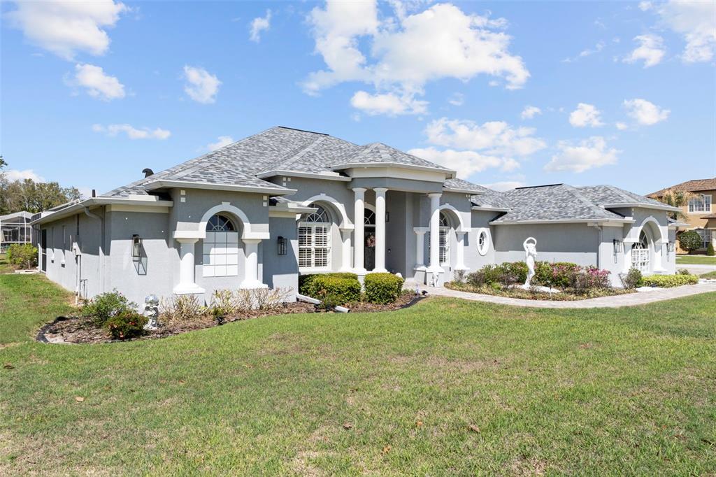 4061 Misty View Drive Spring Hill, FL 34609 - Photo 68 of 70 a front view of a house with a yard