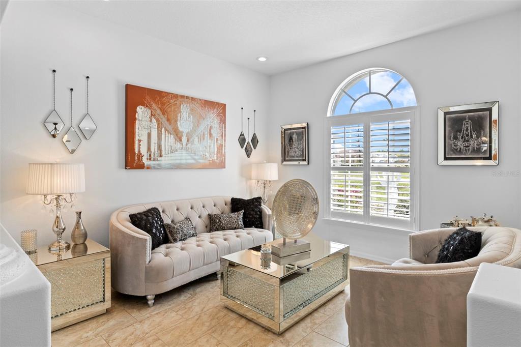 4061 Misty View Drive Spring Hill, FL 34609 - Photo 8 of 70 a living room with furniture a couch and a table