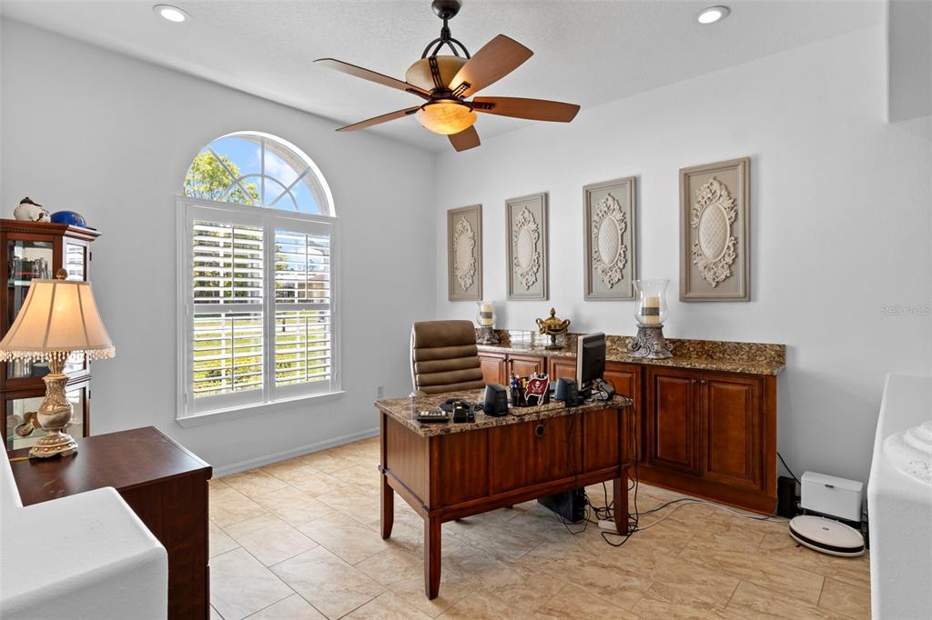 4061 Misty View Drive Spring Hill, FL 34609 - Photo 10 of 70 a living room with furniture a window and a flat screen tv