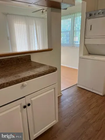 a view of a storage and utility room with washer and dryer