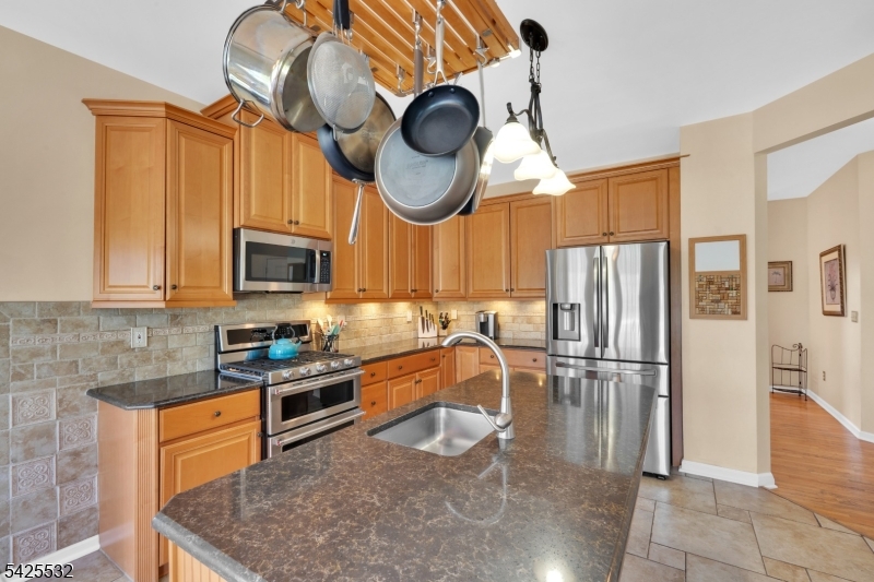 6 Ridge Road Frenchtown, NJ 08825 - Photo 14 of 33 a kitchen with stainless steel appliances granite countertop a sink a stove and a refrigerator