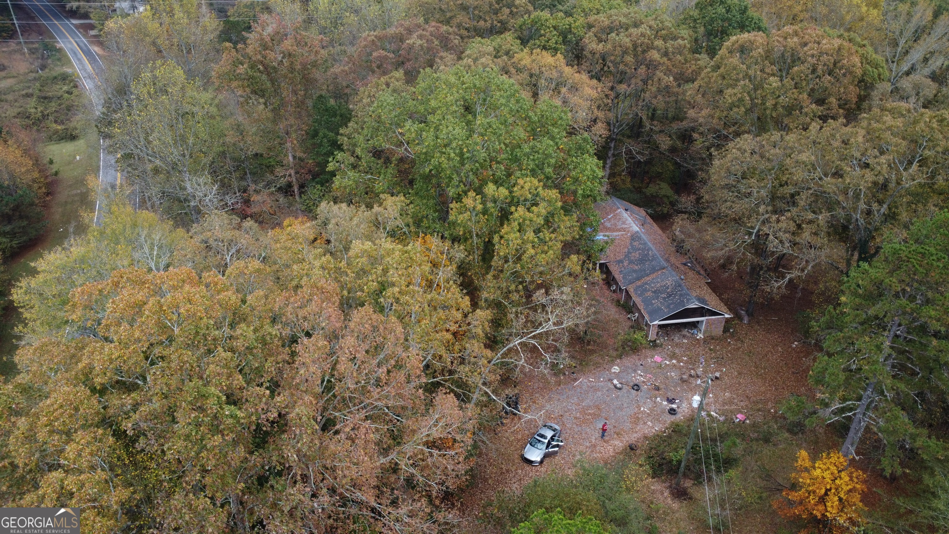 a aerial view of a house with a yard