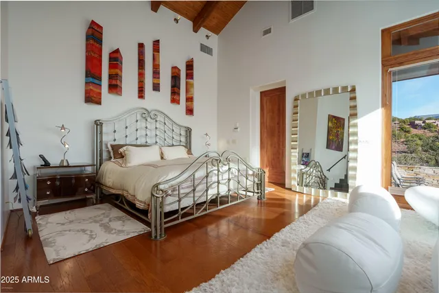 a dining room with furniture window and wooden floor