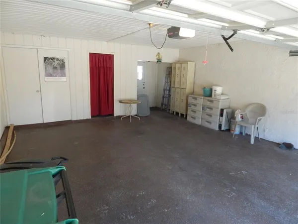 a view of a room with air conditioner duct and materials on floor