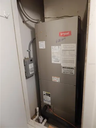 a living room with furniture a window and a chandelier