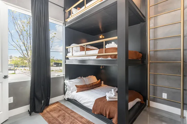 a room with a bed and a window