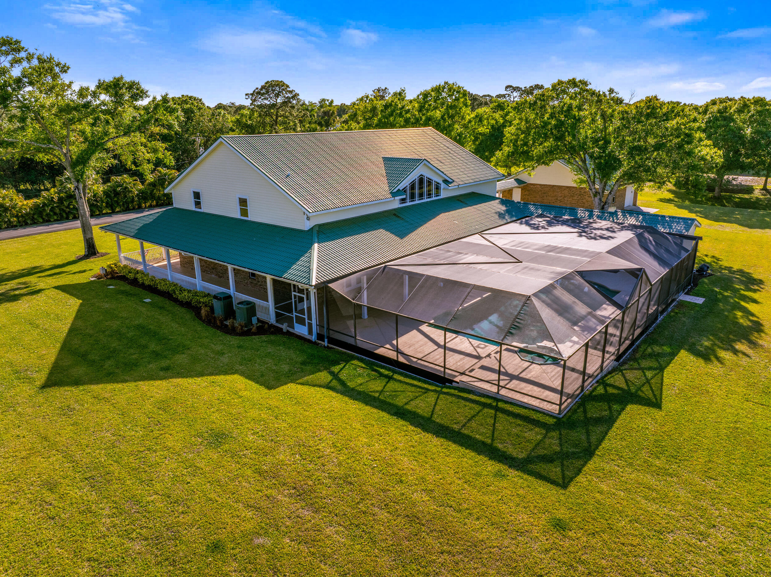 8686 Andrews Avenue Fort Pierce, FL 34945 - Photo 65 of 76 a aerial view of a house with swimming pool
