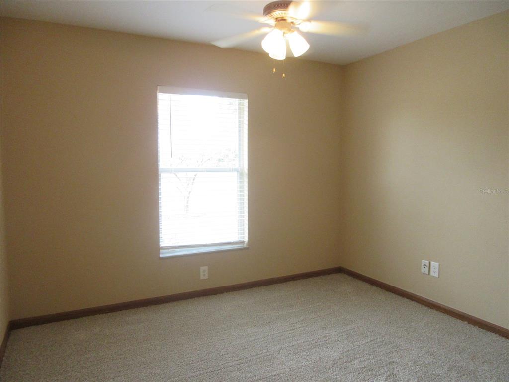 2601 Southeast 175th Terrace Road Silver Springs, FL 34488 - Photo 43 of 87 an empty room with a window