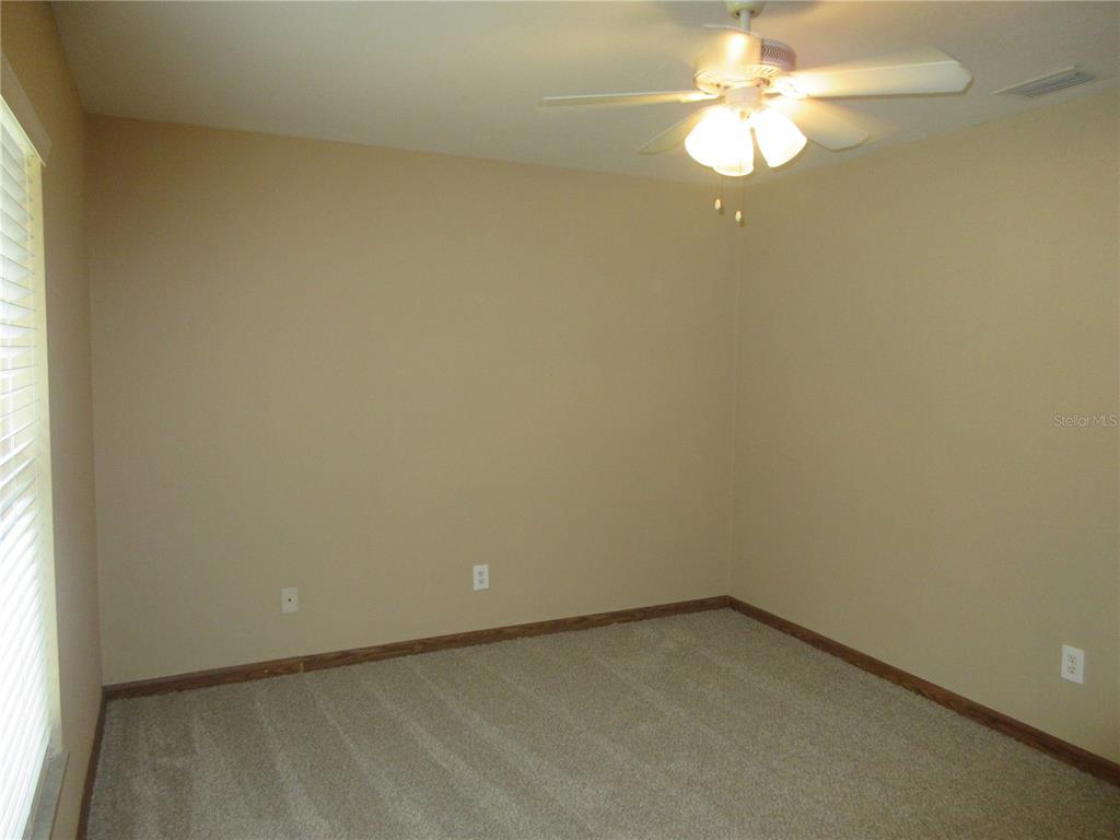 2601 Southeast 175th Terrace Road Silver Springs, FL 34488 - Photo 46 of 87 an empty room with a window