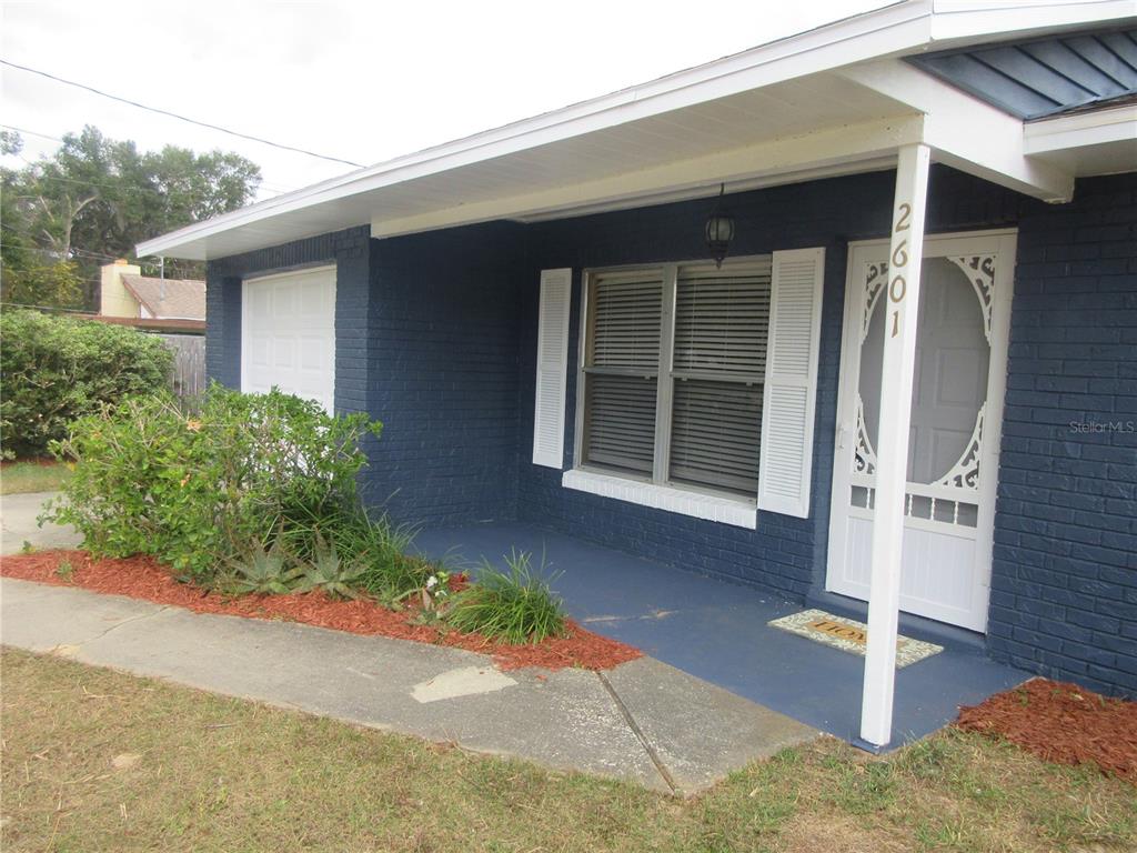 2601 Southeast 175th Terrace Road Silver Springs, FL 34488 - Photo 7 of 87 a front view of a house with a yard