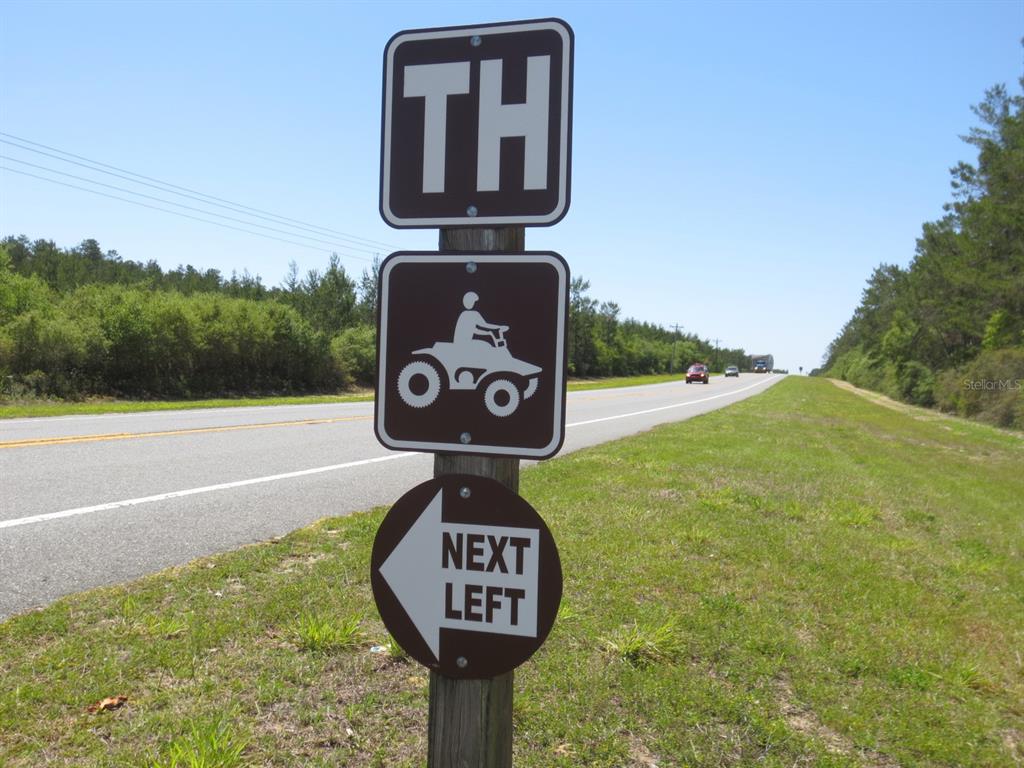 2601 Southeast 175th Terrace Road Silver Springs, FL 34488 - Photo 84 of 87 a front view of a house with a garden