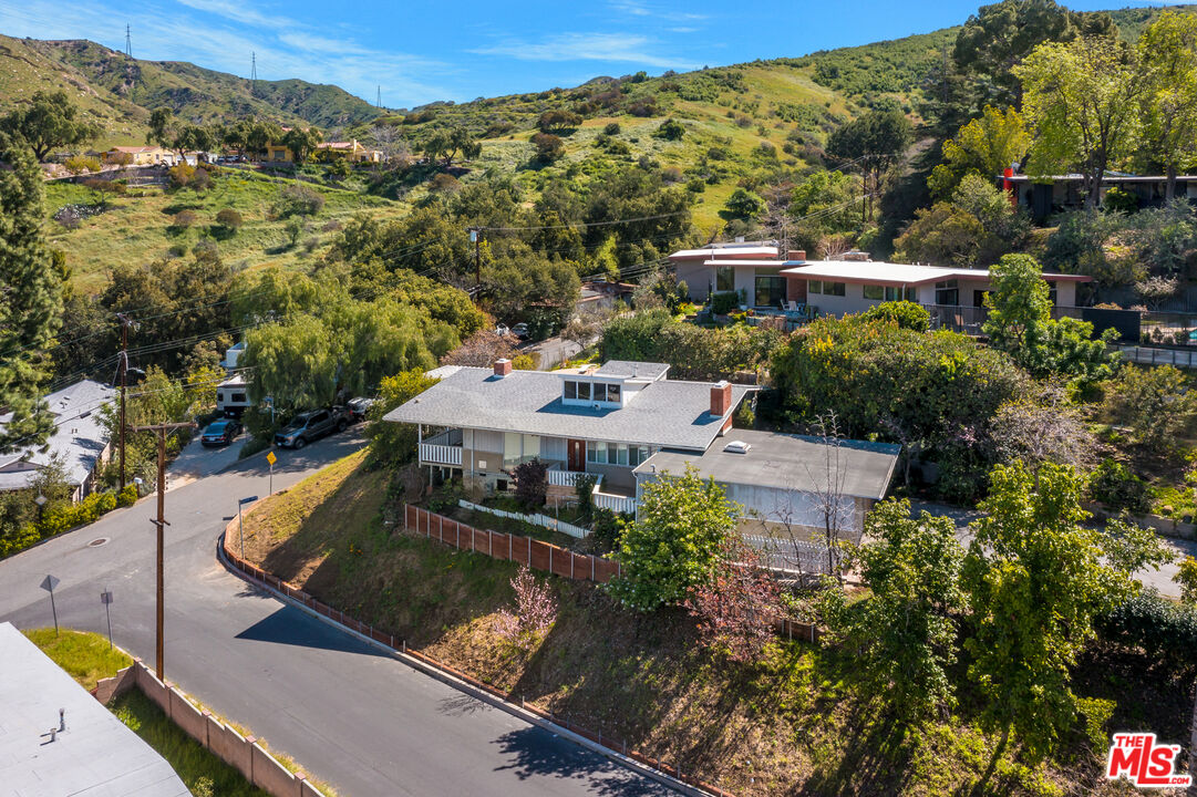 an aerial view of house with yard
