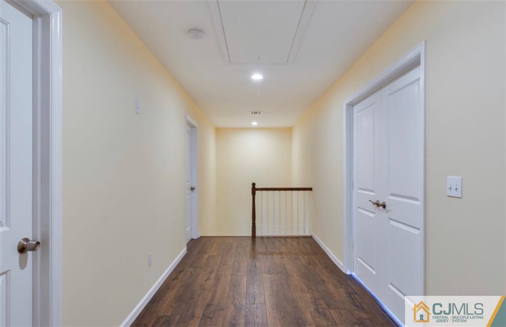 10 Markham Road Edison, NJ 08817 - Photo 11 of 23 a view of a hallway with wooden floor
