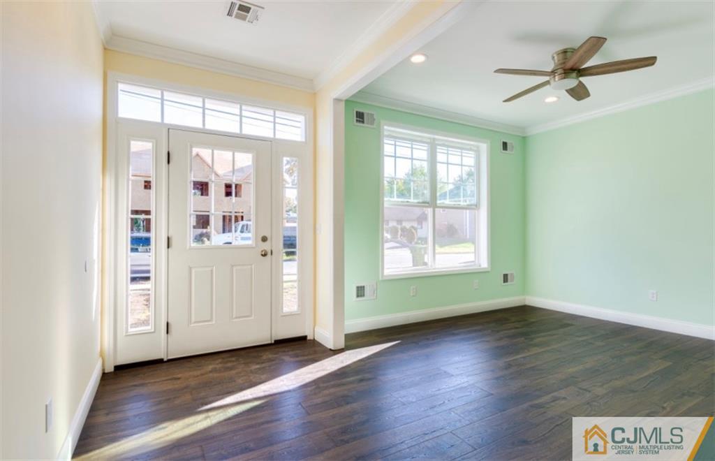 10 Markham Road Edison, NJ 08817 - Photo 2 of 23 a view of livingroom with hardwood floor and window