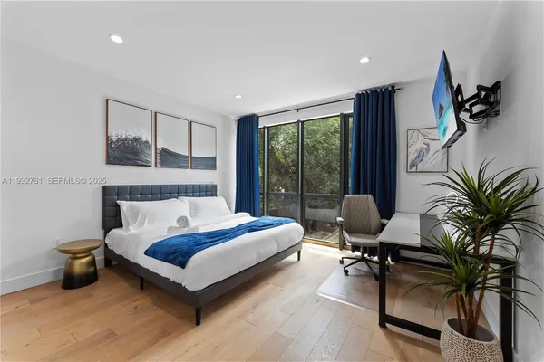 a bedroom with a bed and furniture