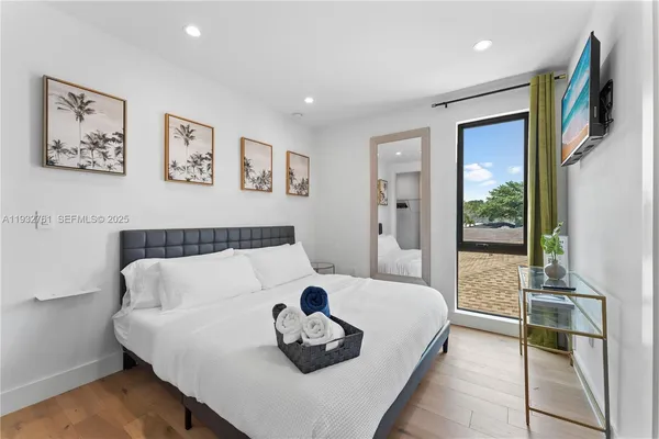 a bedroom with a bed and a couch